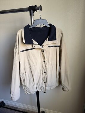 Lightweight Cream Windbreaker Jacket with Black Trim